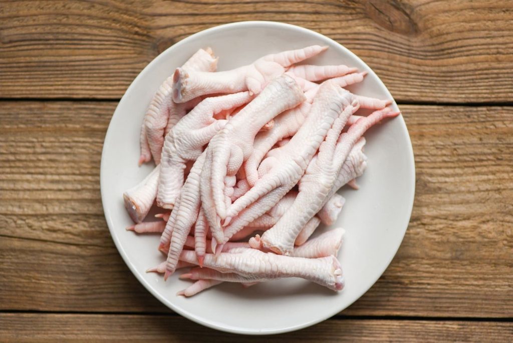 chicken feet on white plate